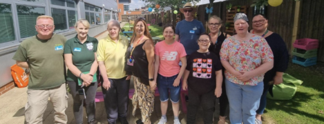 Judges from Northwest in Bloom, people we support from Making Days and some of our staff are all stood in the gardens of our PSS head office. They are smiling at the camera. The judges had just judged our green spaces for the Northwest in Bloom competition.